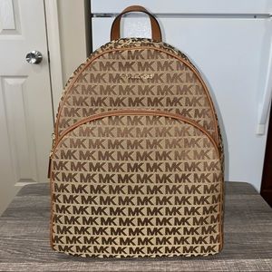 Authentic Michael Kors Erin backpack. NEVER BEEN USED. Great condition
